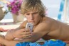 Maybe Alex Pettyfer is checking his latest TextFit message...