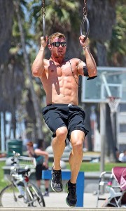**EXCLUSIVE** A shirtless Kellan Lutz goes on a rigorous workout by the beach in LA - jogging along the boardwalk before showing off his skills on the rings